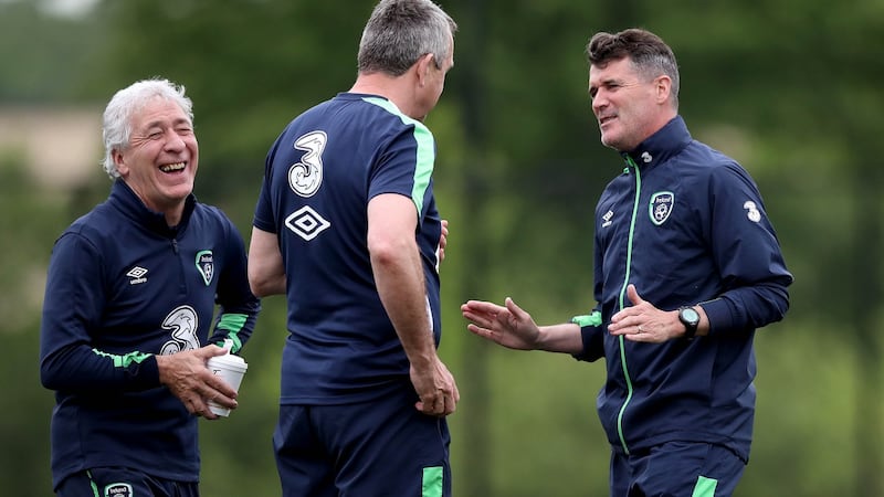 Kitman Mick Byrne shares a joke with assistant manager Roy Keane  and physio Michael Spillane at training. Photograph: Ryan Byrne/Inpho
