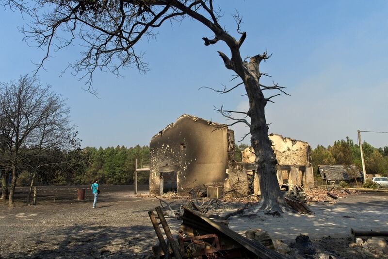 Tthe ruins of a house destroyed by the fire that erupted in Belin-Beliet, near Hostens, southwestern France, pictured on Thursday. Photograph: Guillaume Souvant/AFP via Getty Images