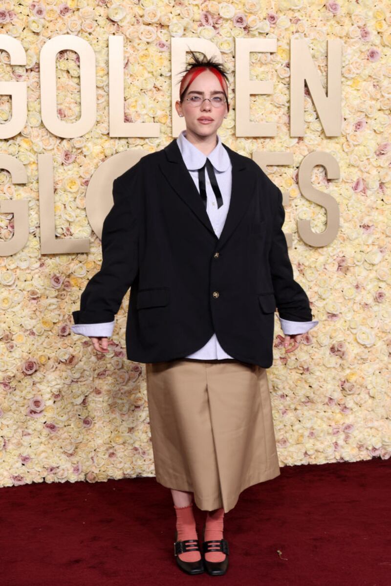 Billie Eilish looked thrift-store chic in a boxy blazer, khaki skirt and Mary Janes with socks a similar color to her bangs. Photograph: Amy Sussman/Getty Images 