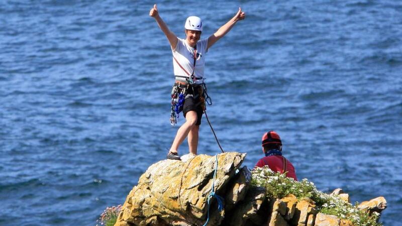 Niamh Gaffney at the top of the sea stack at Crohy Head  yesterday. Photograph: John Rafferty