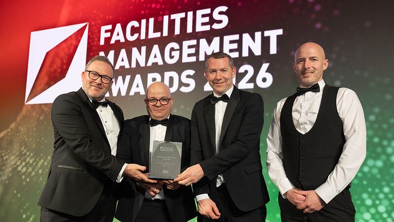 Martin Conneely, business development representative, Western Hygiene, presents the FM service provider team of the year award to the Mitie Facilities Management team