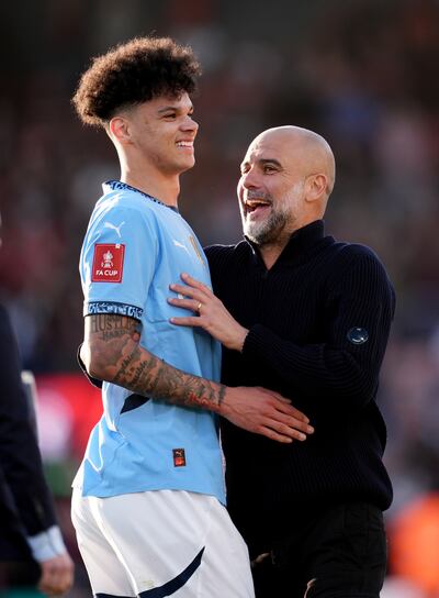 Pep Guardiola and Nico O'Reilly. Photograph: Adam Davy/PA Wire