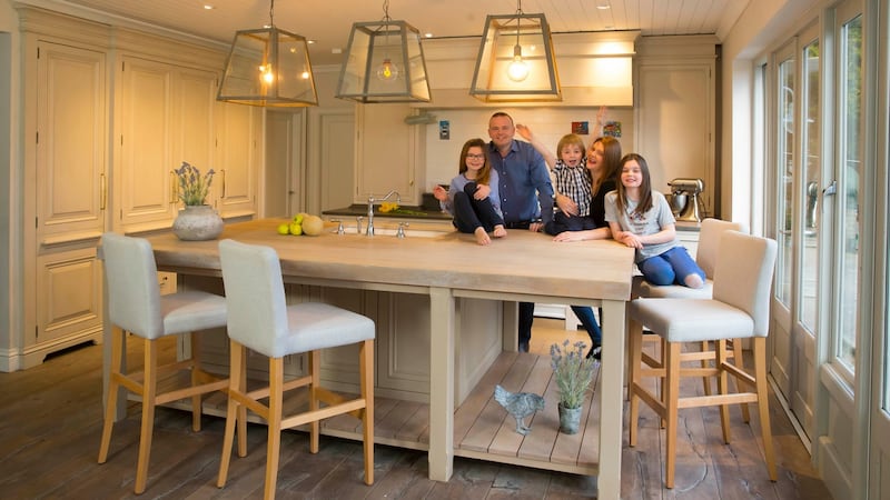 Aiden Ryan and family around the island of their kitchen in Gorey, Co Wexford. Photograph: Patrick Browne