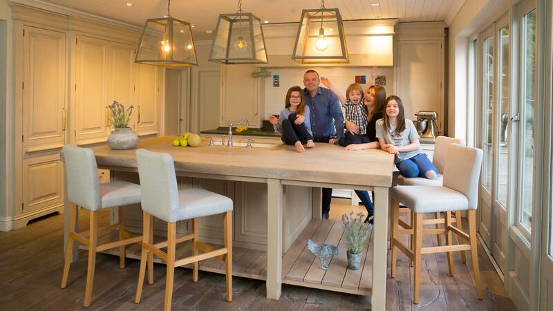 Aiden Ryan and family around the island of their kitchen in Gorey, Co Wexford. Photograph: Patrick Browne