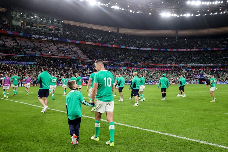 Ireland's Johnny Sexton with his son Luca after the Rugby World Cup quarter-final defeat to New Zealand. Photograph: Dan Sheridan/Inpho 