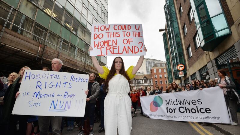 Protesters rally against the  granting of the new National Maternity Hospital to the Sisters of Charity at the Department of Health in Hawkins House, Dublin, this week.   Photograph: Alan Betson/The Irish Times