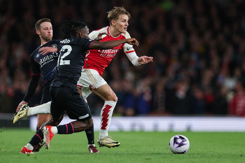 Arsenal's Martin Odegaard in flight. Photograph: Adrian Dennis/AFP via Getty