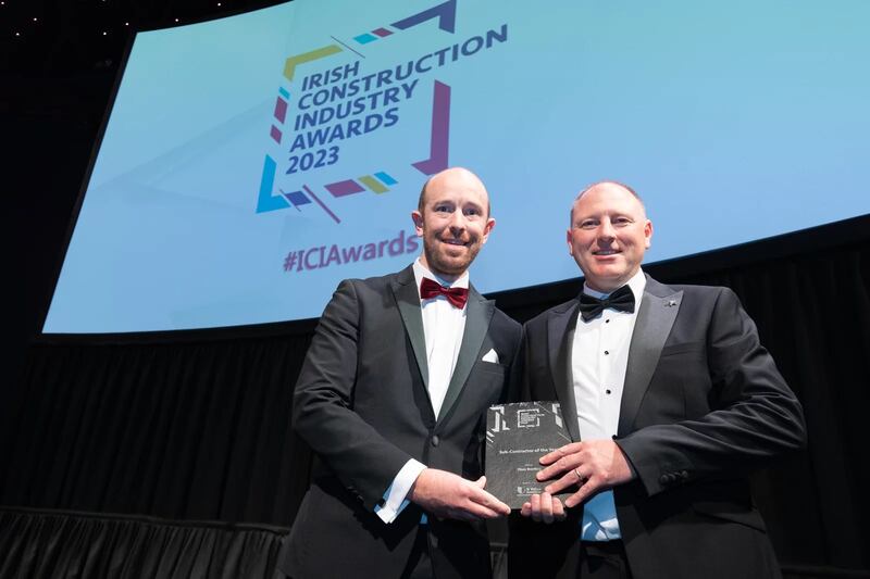 Stephen Gallagher, sales manager at U-Value, presents the sub-contractor of the Year award to Keith Proudfoot, Titan Roofing