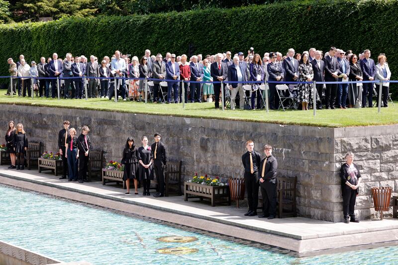 Politicians and guests stand for the national anthem during the ceremony. Photograph: Alan Betson/The Irish Times

