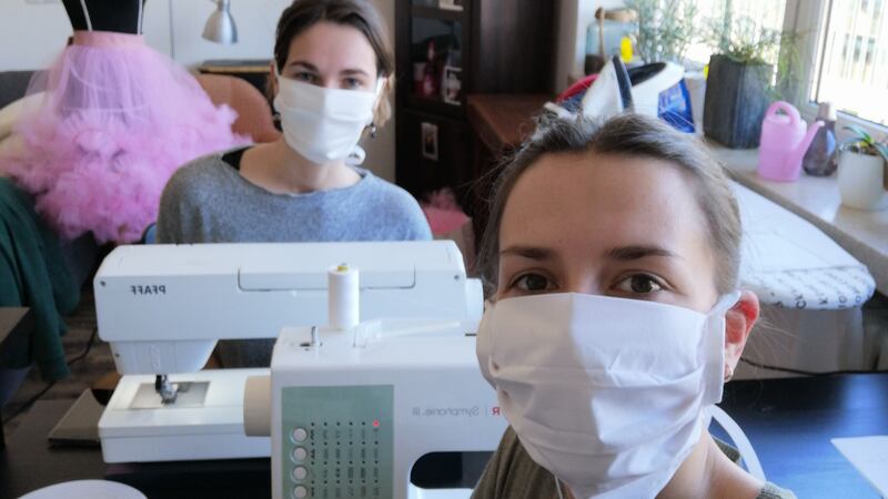 Eleonor Fischer and Wofia Winniger of  the Deutsche Oper am Rhein wardrobe department, in Düsseldorf, producing protective masks.