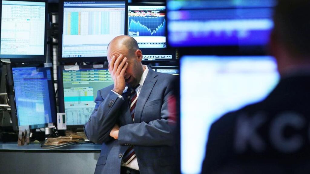 Tough times: a trader on the floor of the NYSE during recent market falls. Photograph: Spencer Platt/Getty Images
