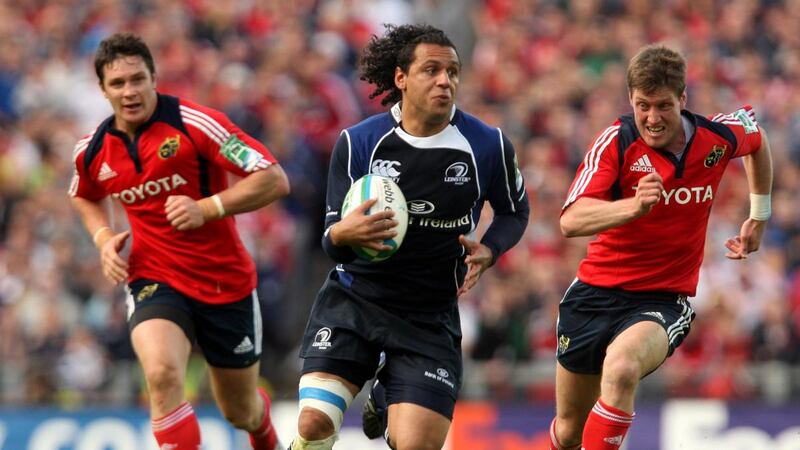 Leinster’s Isa Nacewa runs past Munster’s David Wallace and Ronan O’Gara in their 25-6 victory in the Heineken Cup semi-final. Photograph: James Crombie/Inpho