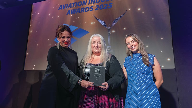 Samantha Harding, awards judge, presents the green impact award to Kirsty Murphy Hughes and Aislinn Ó Sé, DAA