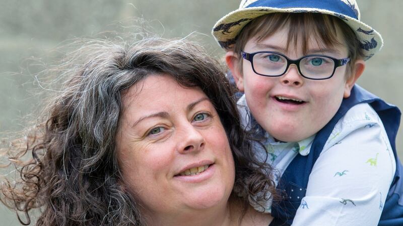Lynda  and her son Sé (9), who has Down syndrome: “Sé was referred for an autism assessment three years ago – it hasn’t even been acknowledged.” Photograph: Tom Honan