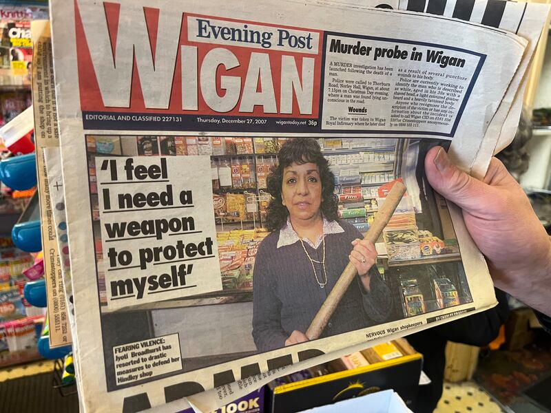 A front page of the Wigan Post from 2012 of baseball bat-wielding local shopkeeper Jyoti Broadhurst. The Tanzanian-Indian immigrant now plans to vote Reform UK. Photograph: Mark Paul