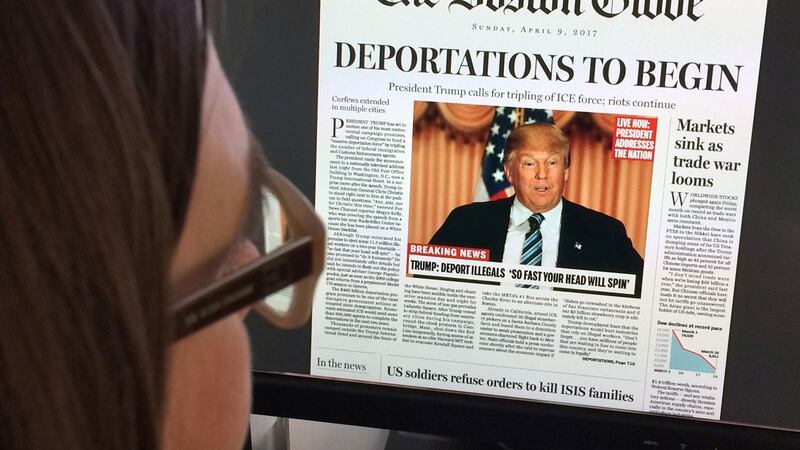 This  photo taken in April 2016 shows a photo illustration taken in Washington, DC showing a woman reading The Boston Globe’s fake headline. File photograph: Karen Bleir/AFP/Getty Images