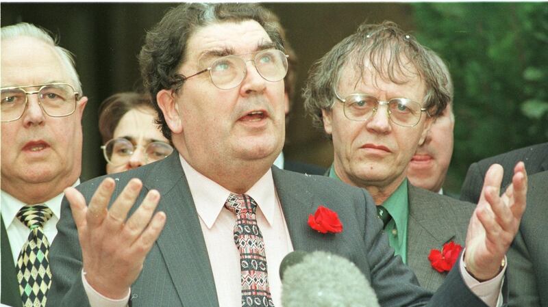 John Hume speaking to the press at the conclusion of talks at Stormont. His role in the agreement ‘arguably wins him a place in Irish history akin to that of O’Connell, Parnell, Pearse and de Valera’.  Photograph: Alan Betson