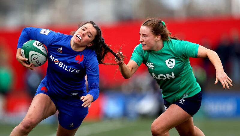 Ireland’s Meabh Deely gets up close and personal with France's Cyrielle Banet during the Six Nations clash at Musgrave Park. Photograph: Ryan Byrne/Inpho 