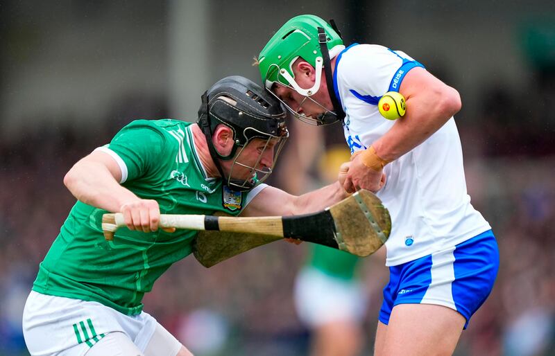 Limerick's Peter Casey clashes heads with Jamie Barron of Waterford. Photograph: James Lawlor/Inpho