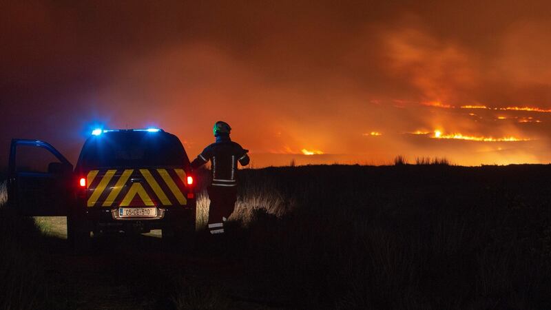 Fire crews from two stations working in to the early hours of  Monday morning to bring a large mountain fire under control in east Clare.  Photograph: Press 22