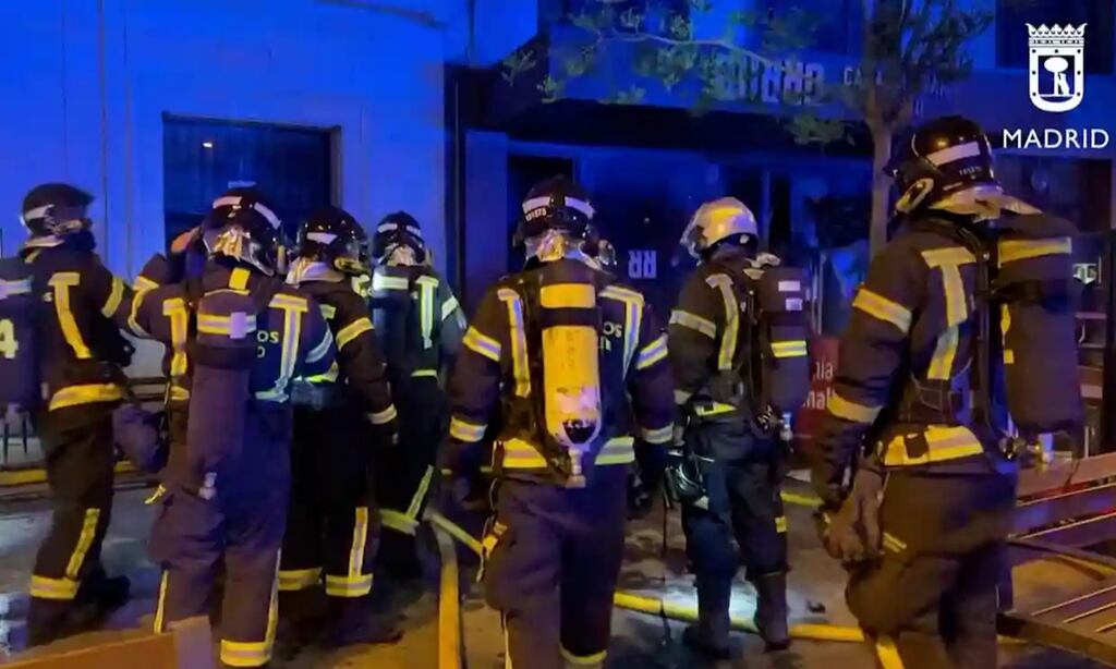 Firefighters at the scene of the fire, in this screengrab taken from a video. Photograph: Reuters