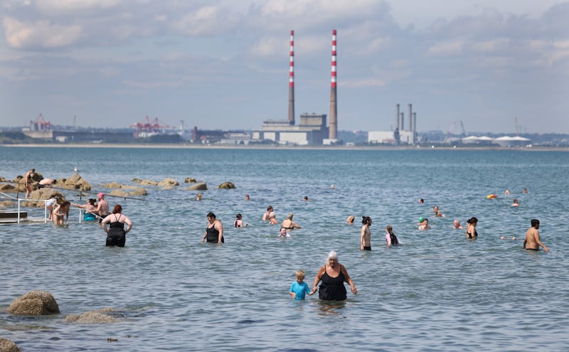 Marcella Inglesmith and her grandson Oakley Inglesmith (5) from Wicklow in the sea with large crowds enjoying the sunshine at Seapoint Strand near Monkstown Co. Dublin. Photograph: Bryan O’Brien/The Irish Times