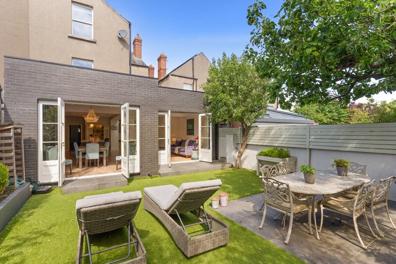 Two sets of doors open out to the rear garden