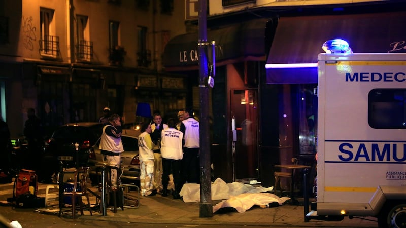 Medics stand by victims in a Paris restaurant, on Friday, November 13th, 2015. Photograph: Thibault Camus/File/AP Photo
