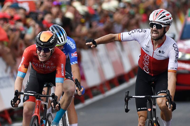 Team Cofidis' Spanish rider Jesús Herrada (right) celebrates as he crosses the finish line in first place during the seventh stage of the Vuelta, a 190km race from Camargo to Cistierna. Photograph: Getty Images