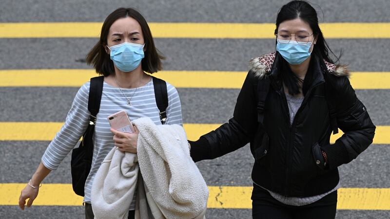 ‘Nobody has seen this virus before. So everyone is susceptible.’ Above, two women in Hong Kong. Photograph: Anthony Wallace/AFP via Getty