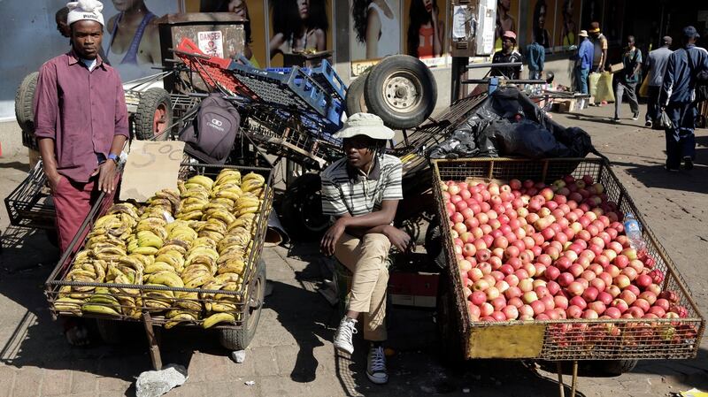 Vendors sell fruits at a market in Bulawayo. In June inflation soared to 175%, the highest rate since Zimbabwe  abandoned its currency in 2009 over excessive money printing and hyperinflation. Photograph: EPA