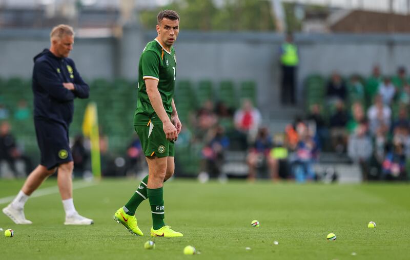 Ireland’s Séamus Coleman surrounded by tennis balls thrown on to the pitch during last month's match against Qatar. Photograph: Ryan Byrne/Inpho