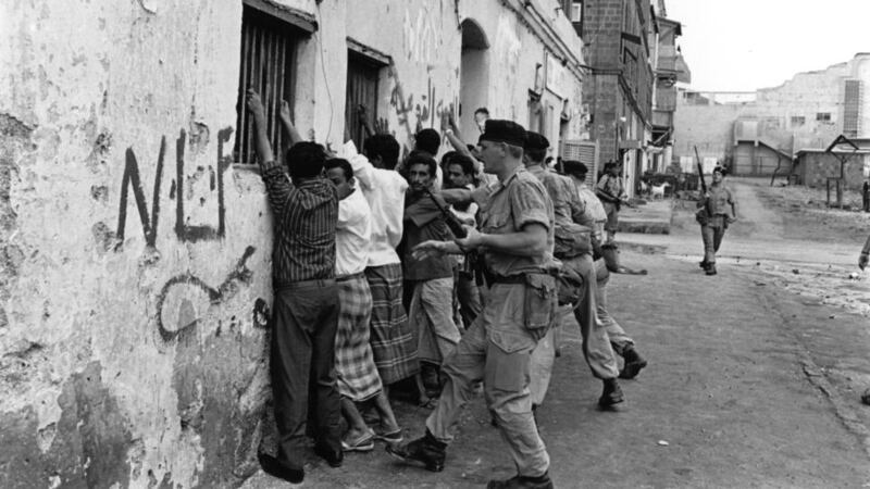 4th April 1967: Soldiers of the Northumberland Fusilier regiment force Arab demonstrators against a wall during nationalist terrorist attacks aiming to expel British forces from South Arabia. Aden became the capital of the People's Republic of Southern Yemen in 1967. (Photo by Terry Fincher/Express/Getty Images)