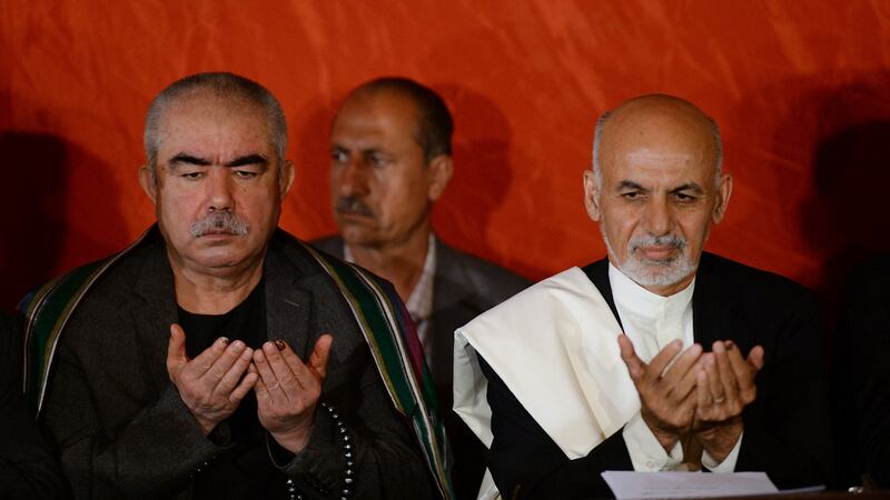 Then presidential candidate Ashraf Ghani (right) with his vice-presidential candidate,   Abdul Rashid Dostum, in 2014. Photograph: Shah Marai/AFP via Getty Images