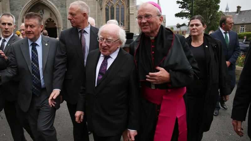 President Micheal D Higgins is welcomed by Bishop Donal McKeown to the funeral of Dr Edward Daly. Photograph: Niall Carson/PA Wire