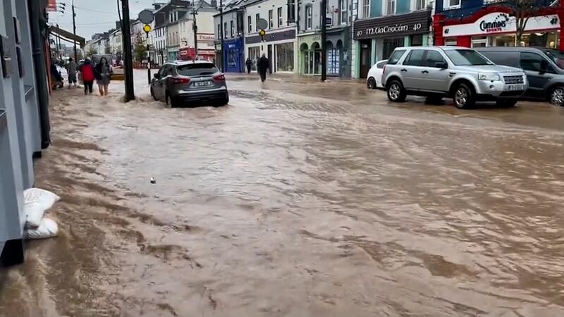 Midleton, Co Cork, attempting to cope with the flooding. Photograph: @realLiamMac/PA 


