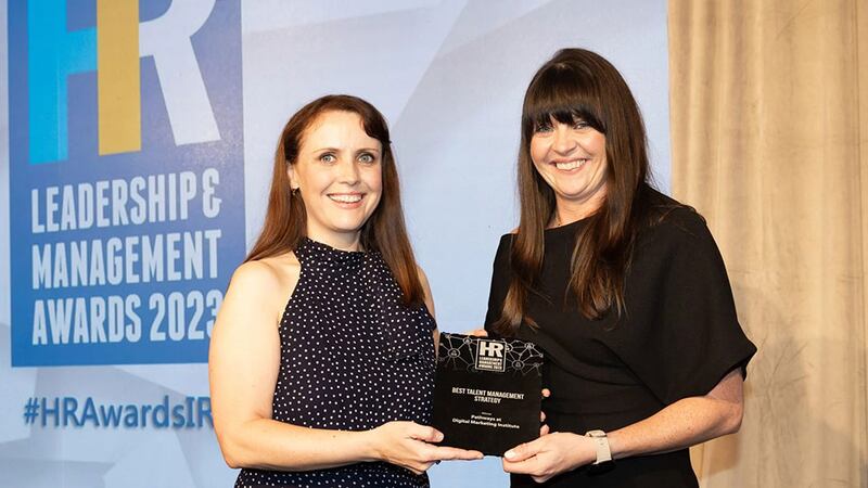 Michelle Ryan, awards judge, presents the best talent management strategy award to Órla Stack, Digital Marketing Institute