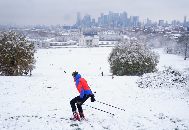 A person skis in the snow at Greenwich Park, London. Photograph: Victoria Jones/PA Wire
