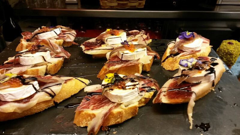 Tapas in San Sebastian of jamon Iberico and cheese on bread