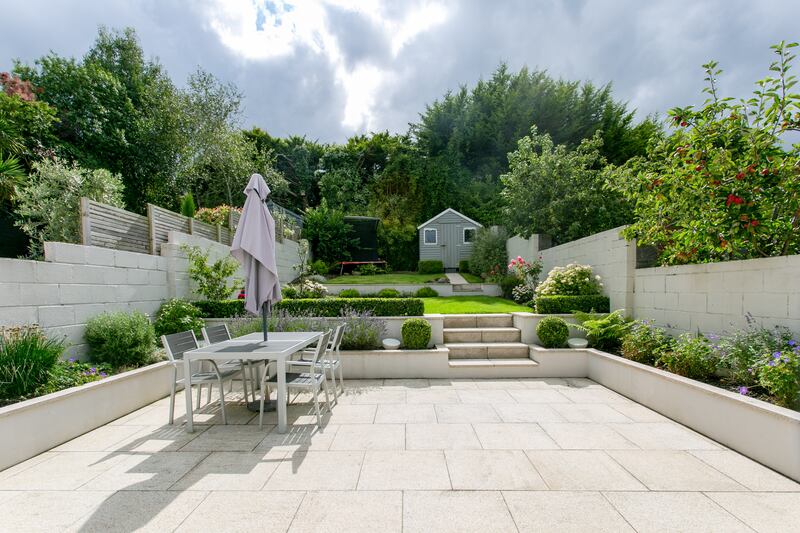 The garden is tiered, with lots of year-round colour. Photograph: Brian Dempsey