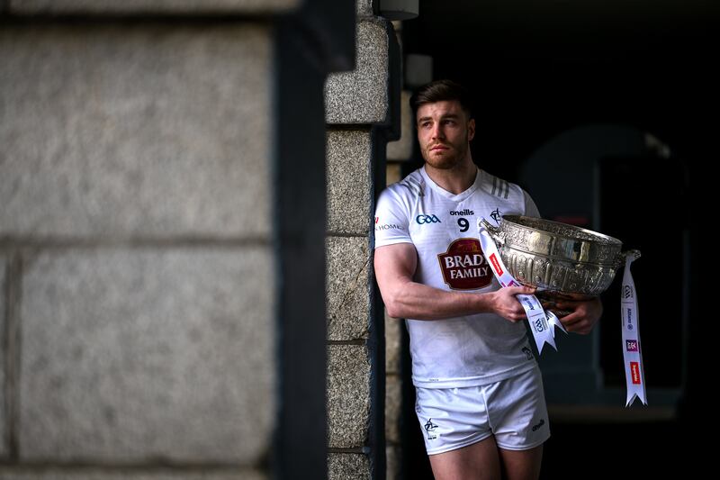 Kevin O’Callaghan of Kildare with the Delaney Cup at the launch of the 2024 Leinster senior football championship at the National Museum of Ireland, Dublin. Photograph: Brendan Moran/Sportsfile 
