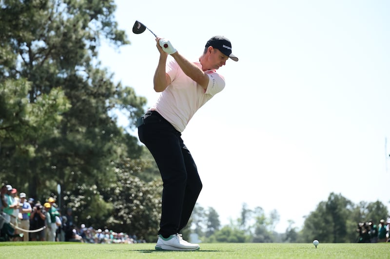 Justin Rose of England plays his shot from the ninth tee. Photograph: Hector Vivas/Getty