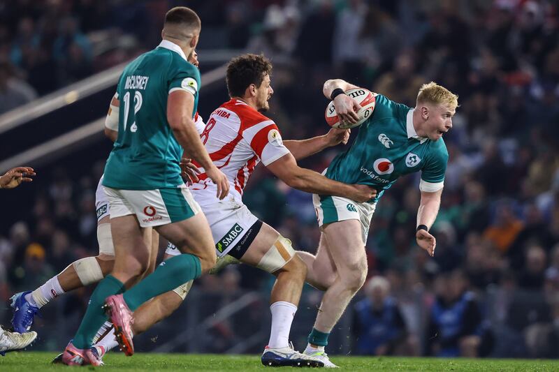 Ireland's Jamie Osborne is tackled by Japan's Jack Cornelsen. Photograph: Ben Brady/Inpho