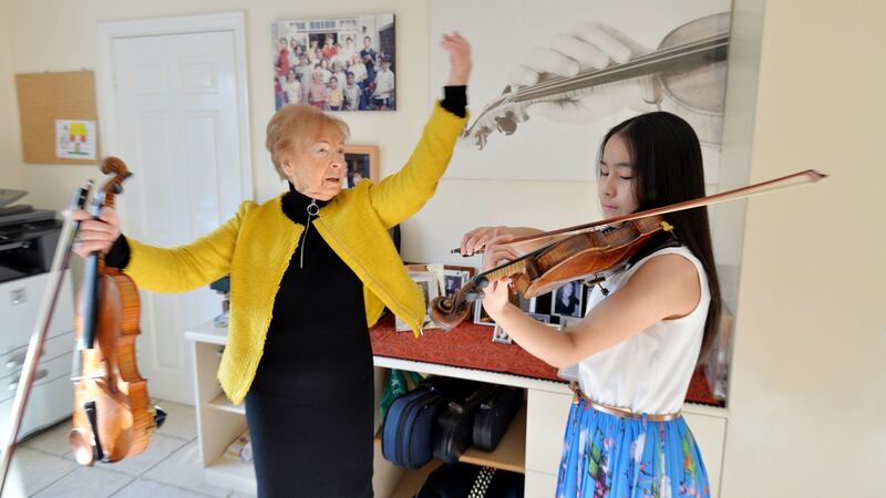 Maria Kelemen, owner of Young European Strings, with violinist Daimee Ng (14). Photograph: Alan Betson