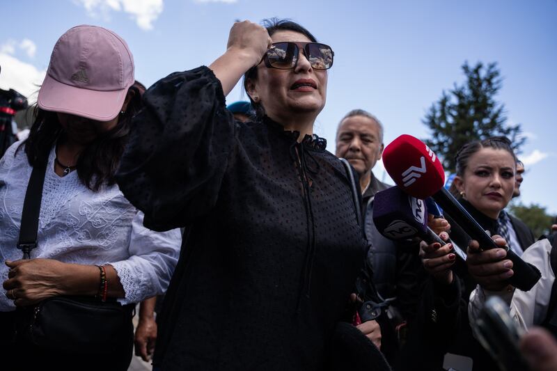 Irina Tejada, a teacher, mourns outside the morgue where the body of presidential candidate Fernando Villavicencio was taken after his assassination in Quito, Ecuador, on Thursday. Photograph: Johanna Alarcón/New York Times
                      