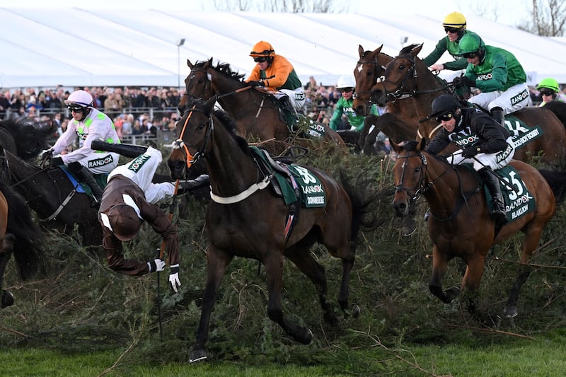 Harry Bannister falls from Domaine De L'Isle as they jump The Chair in the 2022 Grand National. Photograph: Paul Ellis/AF/Getty