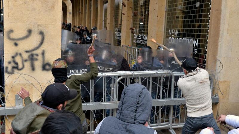 Anti-government protesters clash with Lebanese riot police during a protest outside of the parliament in downtown Beirut on January 18th. Photograph: Wael Hamzeh/EPA