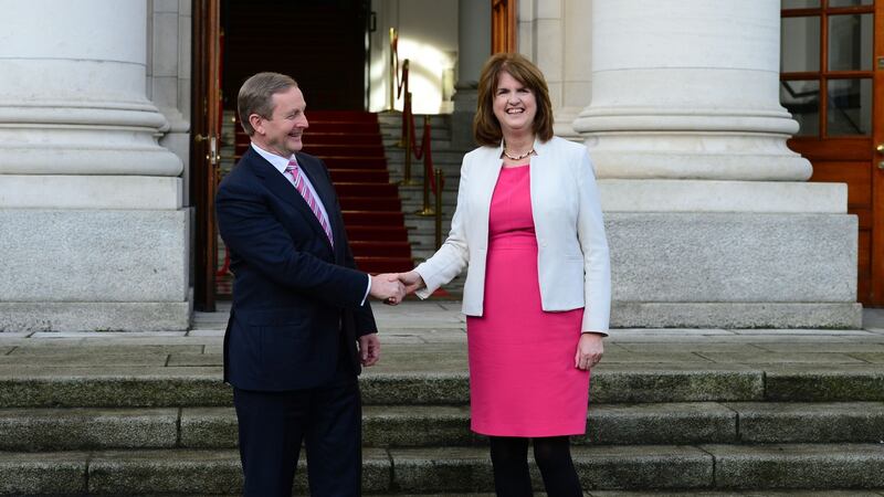 Taoiseach Enda Kenny and Tanaiste Joan Burton outside Government Buildings before he left  for Aras an Uachtarain, where President Michael D Higgins  dissolved the Dail. Photograph: Dara Mac Dónaill / The Irish Times