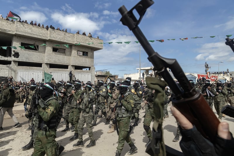 A show of force during a public hostage handover ceremony by Hamas. Photograph: Saher Alghorra/The New York Times
                      