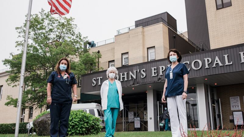 Siobhán  Kates, Carmel Mangan and Elizabeth Gallo outside their workplace, St John’s Episcopal Hospital in Queens, New York. Photograph: Lauren Crothers